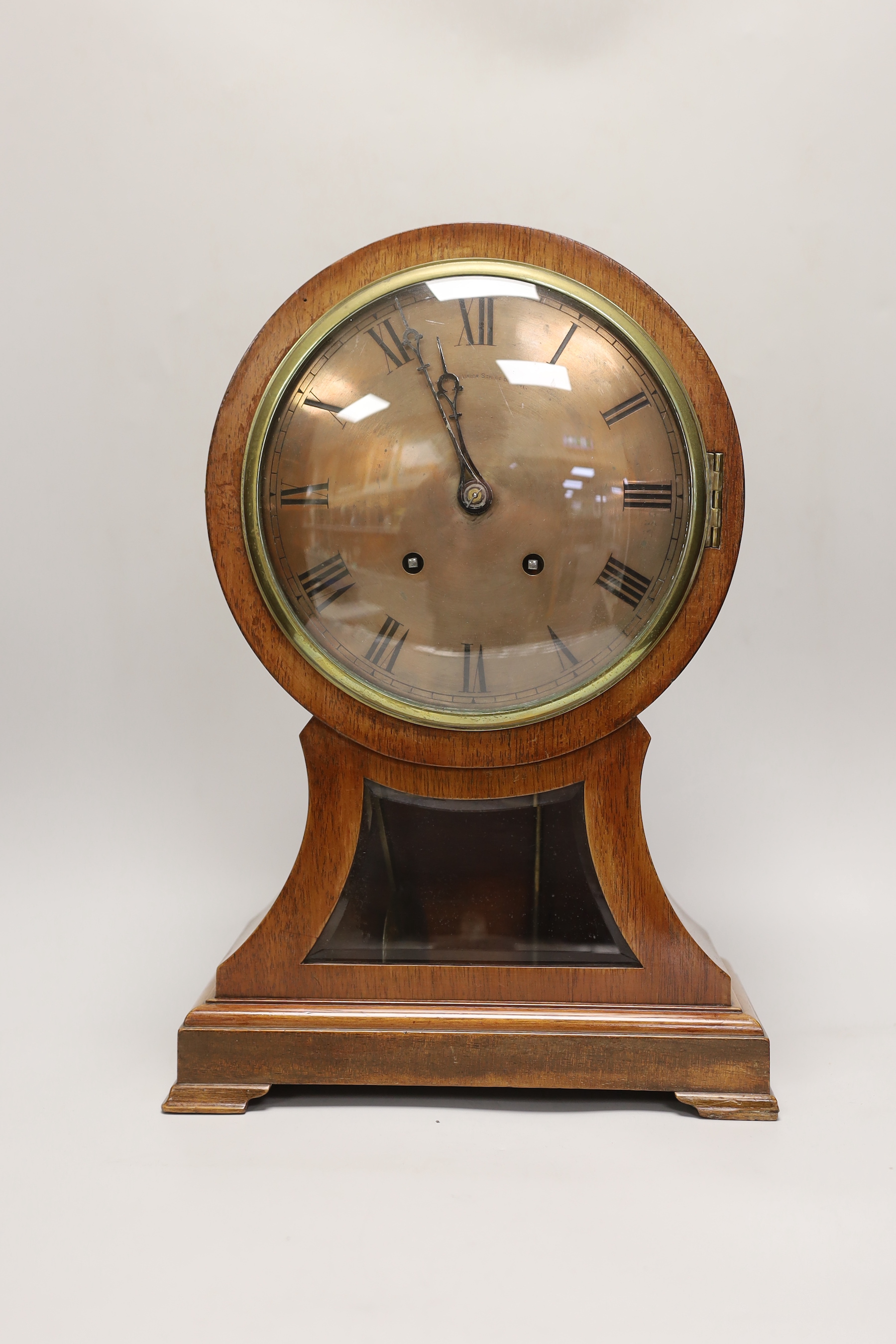 A late 19th century balloon mantel clock with silvered dial, 41cm